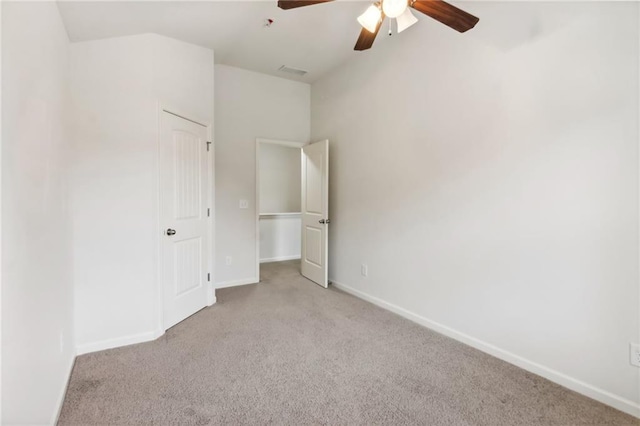 unfurnished bedroom with visible vents, ceiling fan, baseboards, and carpet floors