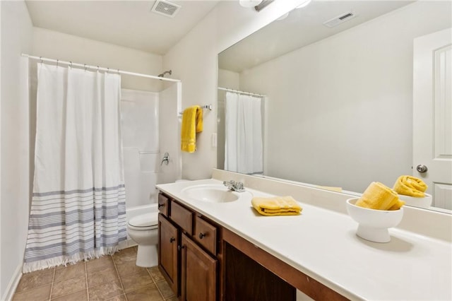 full bathroom with visible vents, toilet, vanity, and tile patterned flooring