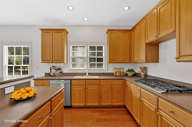 2372 Oberon Walk SE, Smyrna, GA 30080 - kitchen with appliances with stainless steel finishes, recessed lighting, light wood-style flooring, a sink, and dark countertops