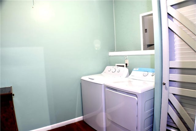 laundry area featuring dark hardwood / wood-style flooring and washing machine and dryer