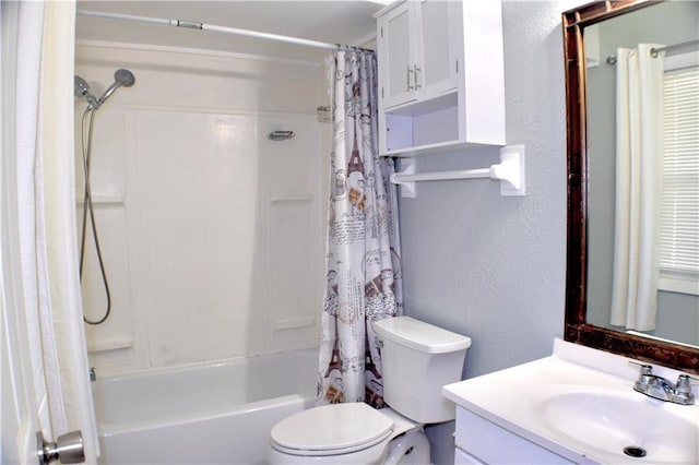 full bathroom featuring vanity, shower / bath combination with curtain, and toilet