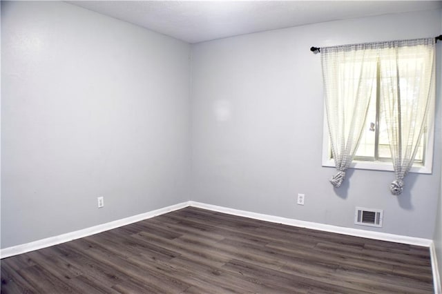 empty room featuring dark hardwood / wood-style floors