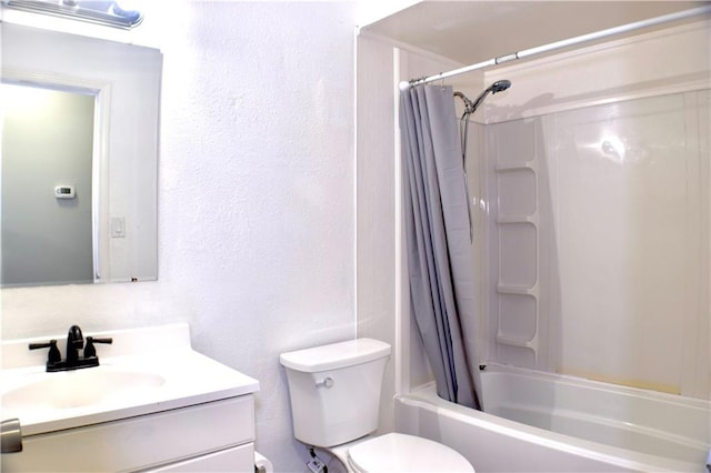 full bathroom with shower / bath combo, vanity, and toilet