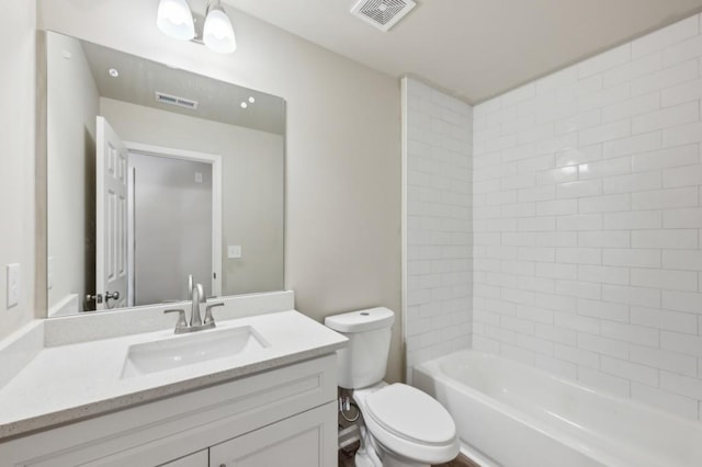 full bathroom featuring toilet, visible vents, tub / shower combination, and vanity