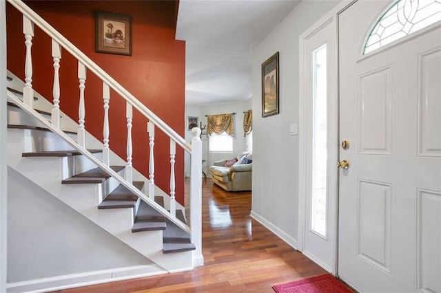 foyer entrance featuring hardwood / wood-style floors