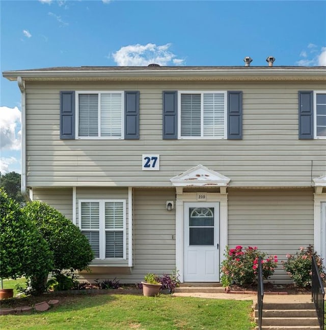 view of front of home with a front yard