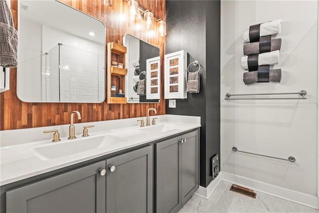 bathroom with vanity and a shower with shower door