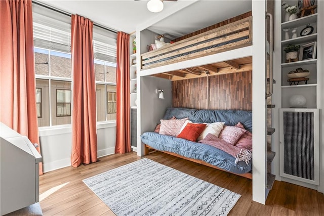 bedroom with hardwood / wood-style flooring