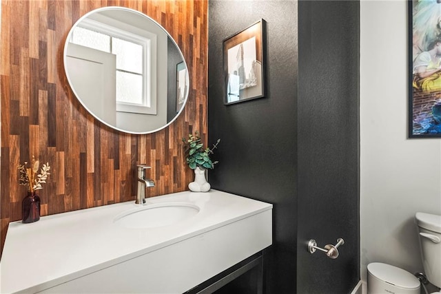 bathroom featuring vanity and toilet