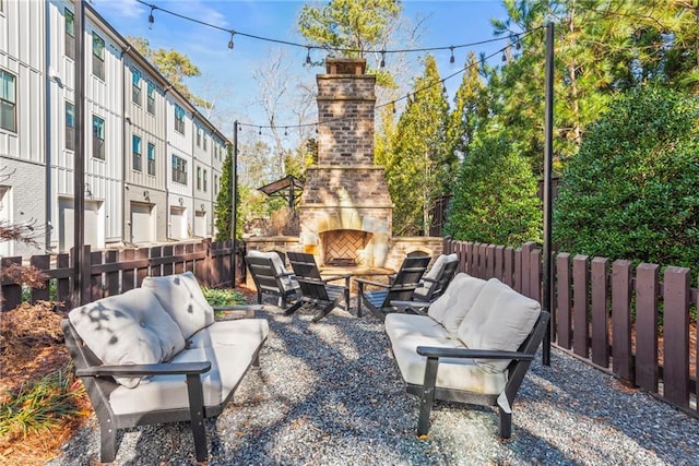 view of patio featuring an outdoor living space with a fireplace