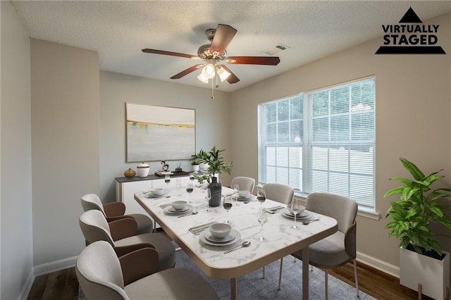 4045 Meadow Glen Way, Fairburn, GA 30213 - dining area featuring wood finished floors, a textured ceiling, visible vents, ceiling fan, and baseboards