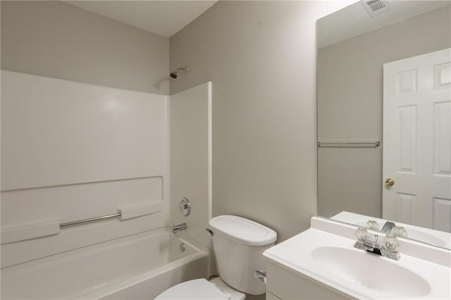 bathroom with toilet, visible vents, washtub / shower combination, and vanity
