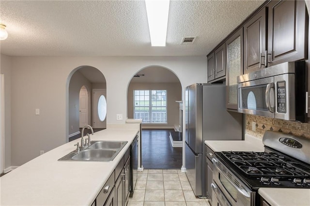 kitchen featuring light countertops, a sink, visible vents, and stainless steel appliances