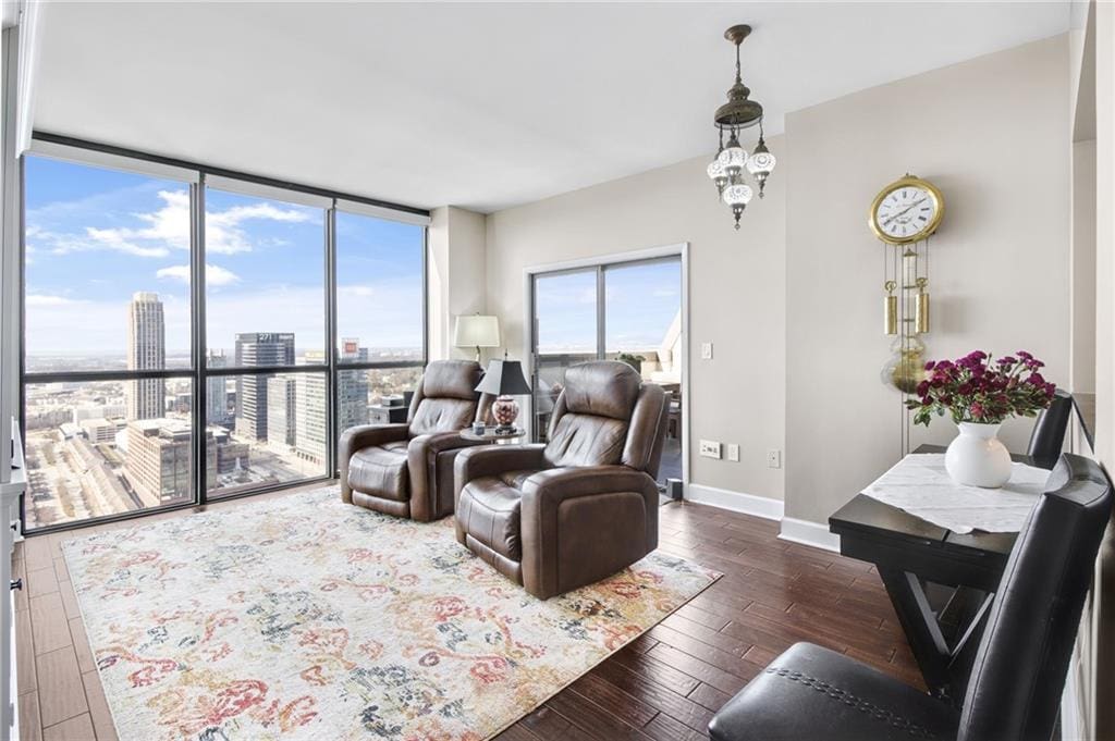 living room featuring dark hardwood / wood-style flooring and expansive windows