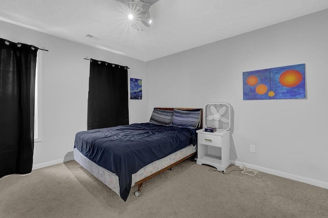 bedroom featuring carpet flooring and baseboards