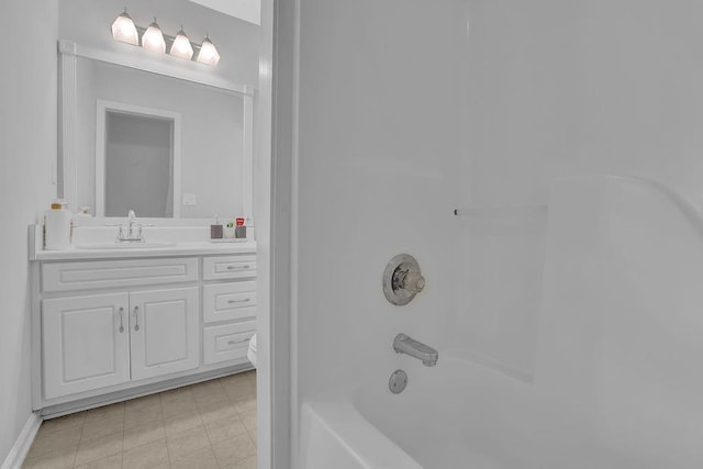 bathroom with vanity, toilet, and bathing tub / shower combination