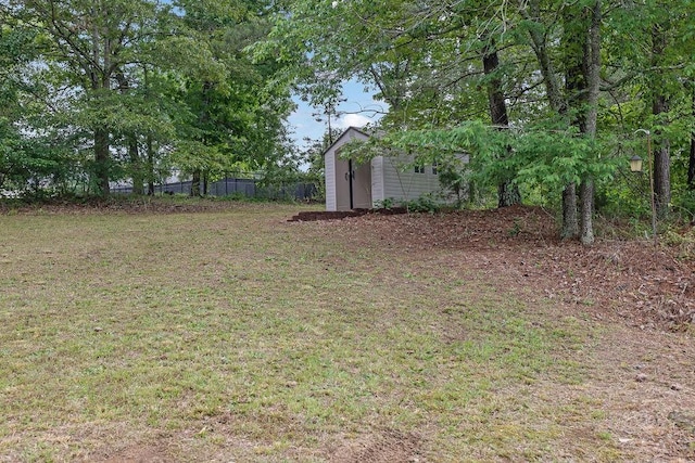 view of yard with an outdoor structure and a storage shed