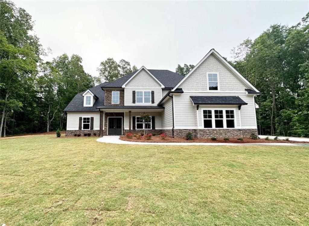 169 W Lake Blvd, Carrollton, GA 30116 - craftsman-style home with a front yard and stone siding