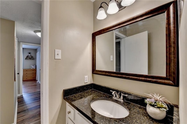 6700 Roswell Rd Unit 22B, Atlanta, GA 30328 - bathroom featuring vanity, wood finished floors, and a chandelier