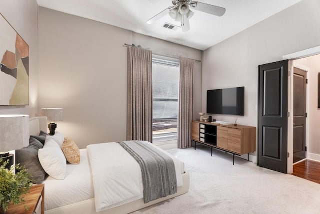 bedroom with ceiling fan and carpet