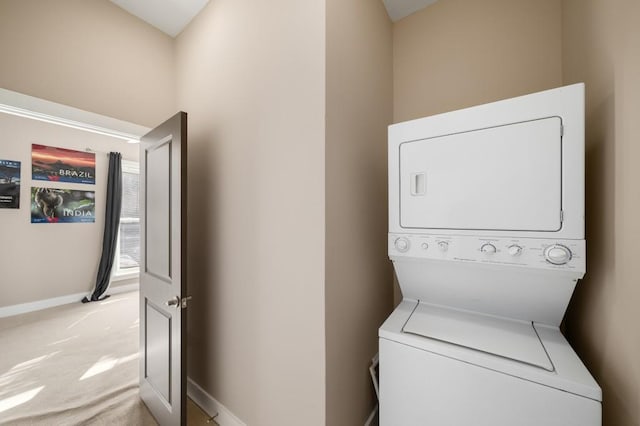 washroom with stacked washer / drying machine and light carpet