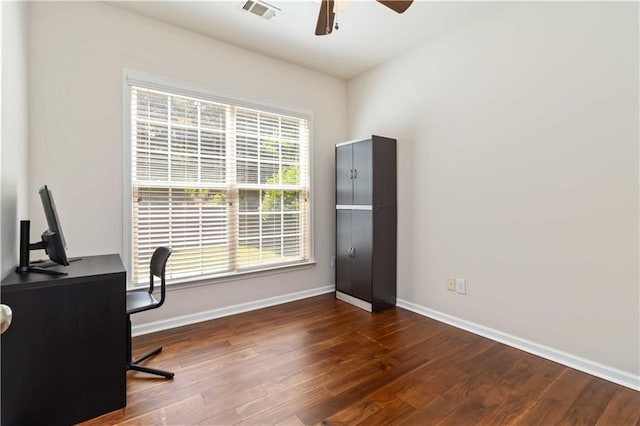 home office with a ceiling fan, baseboards, and wood finished floors