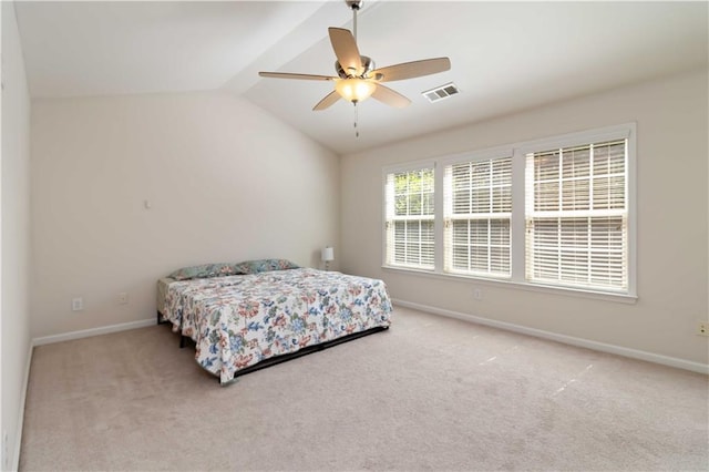 bedroom with carpet, baseboards, vaulted ceiling, and a ceiling fan