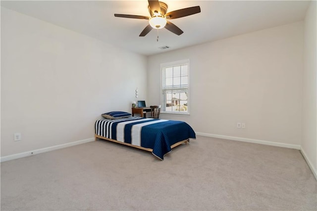 bedroom featuring carpet flooring, baseboards, and a ceiling fan