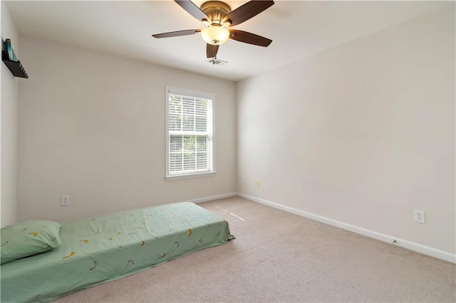 bedroom with baseboards, carpet floors, and a ceiling fan