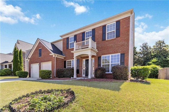 colonial inspired home with brick siding, a balcony, concrete driveway, and an attached garage