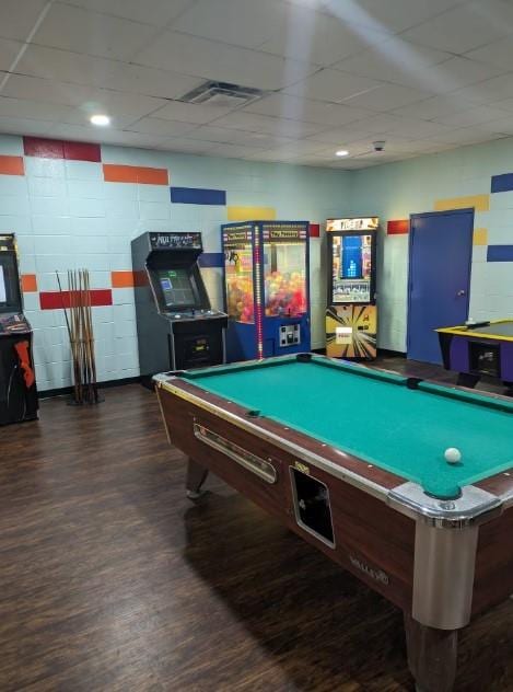 rec room featuring dark wood-type flooring, a paneled ceiling, and billiards