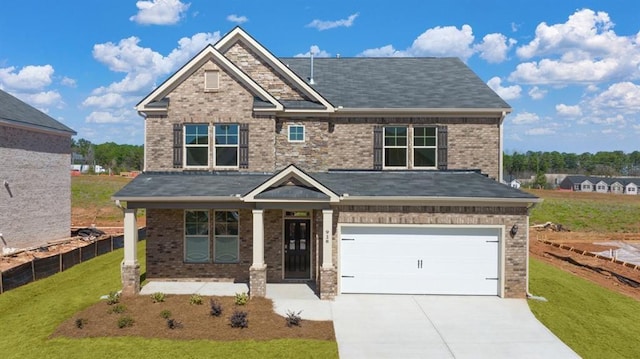 113 Canal St, Hampton, GA 30228 - craftsman-style home featuring a front lawn, concrete driveway, a garage, and brick siding