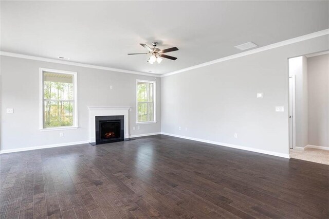 113 Canal St, Hampton, GA 30228 - unfurnished living room featuring ceiling fan, healthy amount of natural light, dark wood-style floors, and ornamental molding