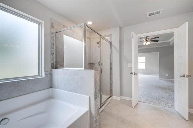 113 Canal St, Hampton, GA 30228 - bathroom with a garden tub, a stall shower, baseboards, a ceiling fan, and recessed lighting