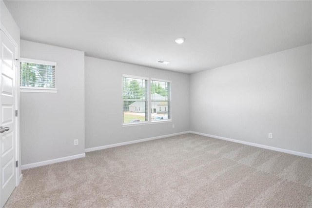 113 Canal St, Hampton, GA 30228 - spare room featuring plenty of natural light, light carpet, and baseboards