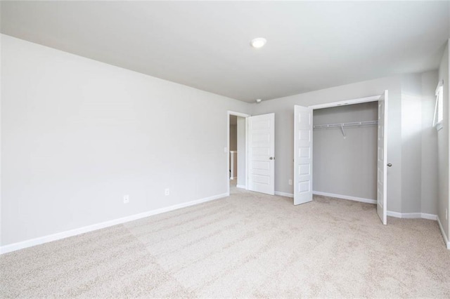 113 Canal St, Hampton, GA 30228 - unfurnished bedroom featuring baseboards, light carpet, a closet, and recessed lighting