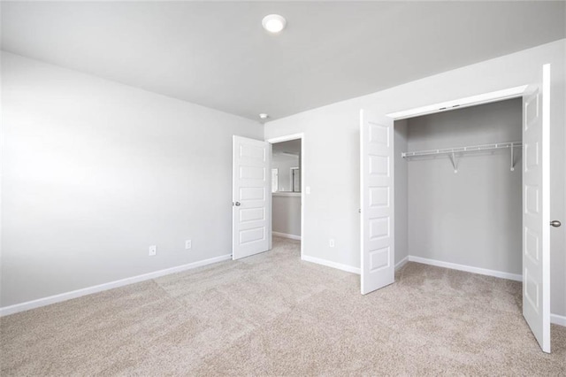 113 Canal St, Hampton, GA 30228 - unfurnished bedroom featuring light carpet, baseboards, and a closet