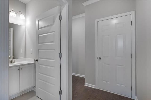 113 Canal St, Hampton, GA 30228 - bathroom with vanity, wood finished floors, and baseboards