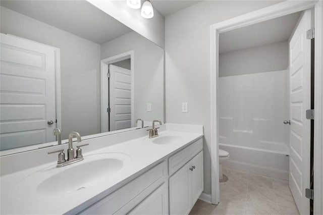 113 Canal St, Hampton, GA 30228 - bathroom featuring toilet, double vanity, and tub / shower combination