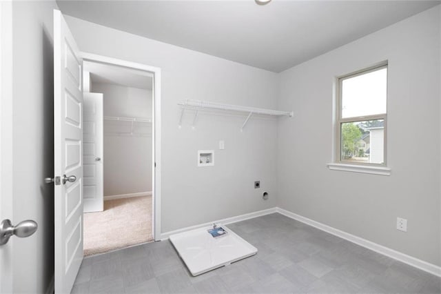 113 Canal St, Hampton, GA 30228 - laundry area featuring hookup for a washing machine, electric dryer hookup, tile patterned floors, and baseboards