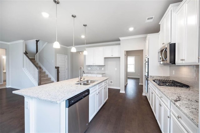 113 Canal St, Hampton, GA 30228 - kitchen with appliances with stainless steel finishes, a sink, baseboards, white cabinetry, and ornamental molding