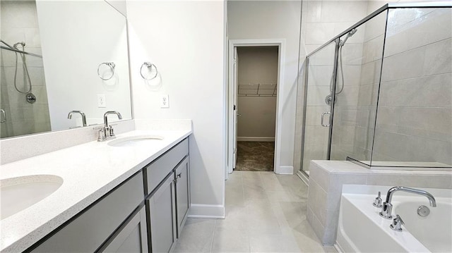 bathroom featuring tile patterned floors, vanity, and separate shower and tub