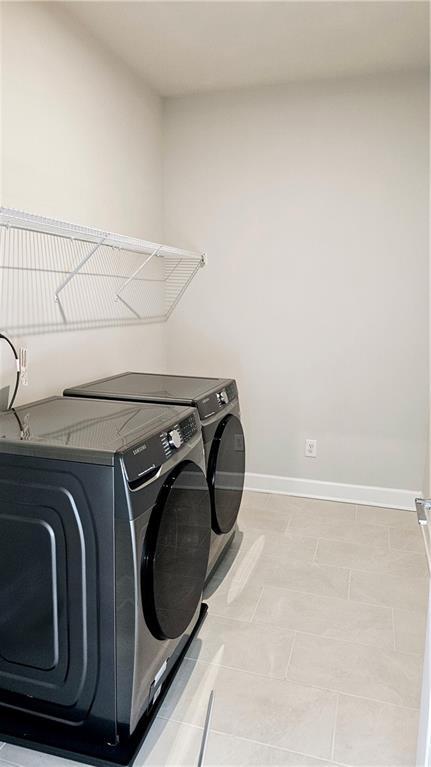 washroom featuring washer and dryer