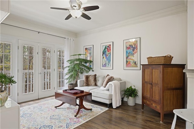 living room with dark hardwood / wood-style flooring, crown molding, french doors, and ceiling fan