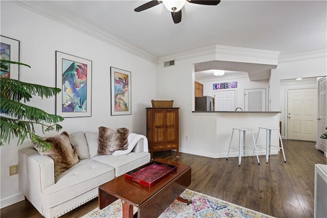 living room featuring crown molding, dark wood-type flooring, and ceiling fan