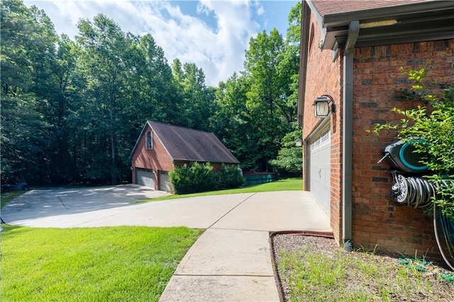 540 Branch Dr, Pendergrass, GA 30567 - view of home's exterior with brick siding, an outdoor structure, a lawn, and a garage