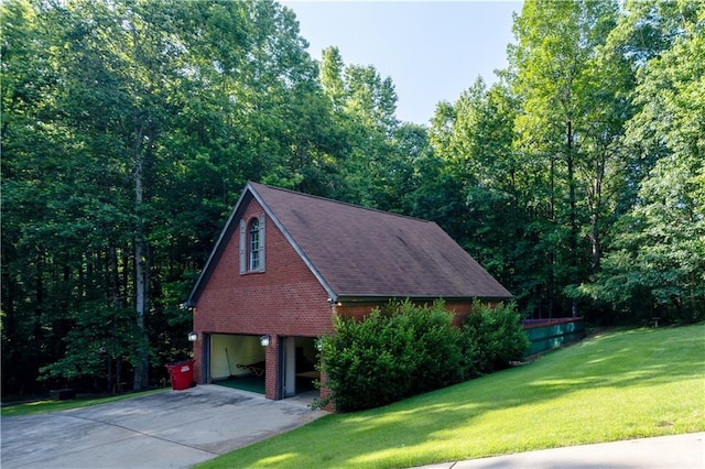 540 Branch Dr, Pendergrass, GA 30567 - view of side of property with driveway, brick siding, a garage, and a yard