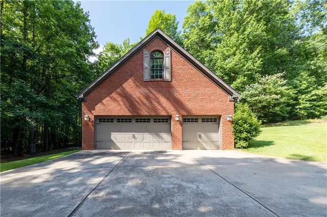 540 Branch Dr, Pendergrass, GA 30567 - view of property exterior featuring concrete driveway, a garage, brick siding, and a yard