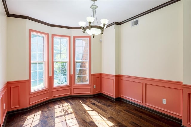 540 Branch Dr, Pendergrass, GA 30567 - empty room with a chandelier, dark wood-type flooring, a wainscoted wall, crown molding, and a decorative wall