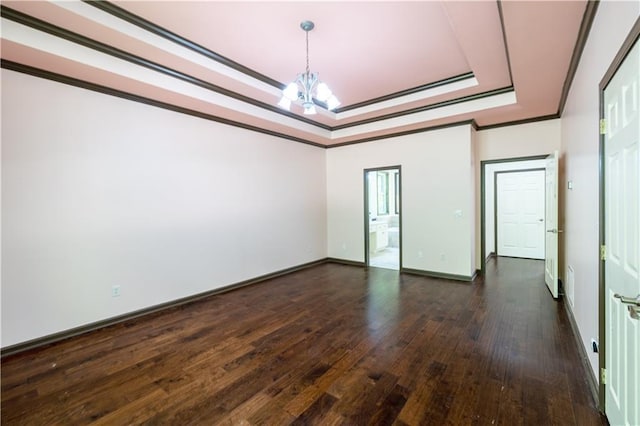 540 Branch Dr, Pendergrass, GA 30567 - spare room featuring a chandelier, dark wood-type flooring, a raised ceiling, and ornamental molding